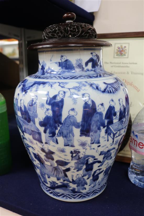 A Chinese blue and white Hundred Boys vase, Transitional period c. 1640, wood stand and cover